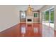 Comfortable living room with fireplace, ceiling fan and access to outdoor space through sliding glass doors at 875 Bentley Green Cir, Winter Springs, FL 32708