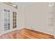 Bright office space with hardwood floors and French doors leading to the outside at 875 Bentley Green Cir, Winter Springs, FL 32708