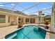 Inviting screened in pool with a jacuzzi at 875 Bentley Green Cir, Winter Springs, FL 32708