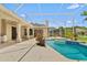 Screened in pool and spa with a lush garden view at 875 Bentley Green Cir, Winter Springs, FL 32708