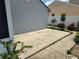 Concrete backyard patio with landscaping offering a tranquil outdoor living area at 8850 Pine Bay Ct, Orlando, FL 32825