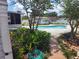 Backyard with a pool, shed, privacy fence and professional landscaping at 8850 Pine Bay Ct, Orlando, FL 32825