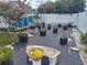 Backyard garden featuring various potted plants, raised beds, and a bench for relaxing at 8850 Pine Bay Ct, Orlando, FL 32825