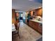 Traditional kitchen with wood cabinetry, black appliances, and updated countertops at 8850 Pine Bay Ct, Orlando, FL 32825