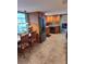Charming kitchen with wood cabinets, stainless steel appliances, and a cozy breakfast nook with natural light at 8850 Pine Bay Ct, Orlando, FL 32825