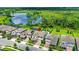 Aerial view of a charming home near a tranquil lake and lush green landscape at 9068 Sonoma Coast Dr, Winter Garden, FL 34787