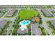 Aerial view of neighborhood with large grassy area, playground, and community pool at 9068 Sonoma Coast Dr, Winter Garden, FL 34787