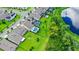 A picturesque neighborhood with houses featuring pools and fenced yards adjacent to a scenic lake at 9068 Sonoma Coast Dr, Winter Garden, FL 34787