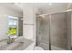 Modern bathroom with walk-in shower, granite countertop and tiled walls at 9068 Sonoma Coast Dr, Winter Garden, FL 34787