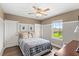 Comfortable bedroom with natural light and view to the outdoors at 9068 Sonoma Coast Dr, Winter Garden, FL 34787
