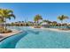 Expansive community pool featuring lounge chairs and sun umbrellas, perfect for relaxation at 9068 Sonoma Coast Dr, Winter Garden, FL 34787