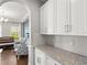 Close up of kitchen featuring white cabinets, granite counters, and stainless steel appliances at 9068 Sonoma Coast Dr, Winter Garden, FL 34787