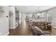 Open concept living room and kitchen area featuring wood floors and modern decor at 9068 Sonoma Coast Dr, Winter Garden, FL 34787