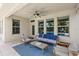 Covered patio with comfortable seating and a ceiling fan, perfect for outdoor relaxation at 9068 Sonoma Coast Dr, Winter Garden, FL 34787