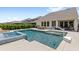 Beautiful pool and spa with an outdoor dining area, and sun loungers, perfect for entertaining or relaxing by the water at 9068 Sonoma Coast Dr, Winter Garden, FL 34787