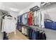 Organized walk-in closet with ample storage space for clothing and accessories at 9068 Sonoma Coast Dr, Winter Garden, FL 34787