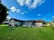 A spacious backyard with a screened-in patio offering ample room for outdoor enjoyment at 1025 Sullivan St, Deltona, FL 32725
