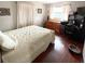 This bedroom features a large window, hardwood floors, and neutral paint at 1025 Sullivan St, Deltona, FL 32725