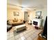 Cozy living room with a decorative fireplace, comfortable seating, and tile flooring at 1025 Sullivan St, Deltona, FL 32725