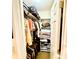 Organized walk-in closet featuring shelving, hanging rods, and ample storage space for clothes and accessories at 1025 Sullivan St, Deltona, FL 32725