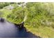 Scenic aerial view shows lush foliage and waterfront access, perfect for nature lovers at 1021 Jaybee Ave, Davenport, FL 33897