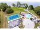 Aerial view showcasing tennis court and pool amenities, ideal for recreation and relaxation at 1021 Jaybee Ave, Davenport, FL 33897