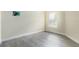 Cozy room with light gray wood-look flooring and natural light at 1021 Jaybee Ave, Davenport, FL 33897