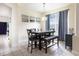 Cozy dining area with modern table set, pendant lighting, and neutral walls at 1021 Jaybee Ave, Davenport, FL 33897