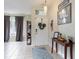 Bright foyer with tile flooring, decorated white door and tasteful decor at 1021 Jaybee Ave, Davenport, FL 33897