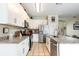 Modern kitchen with stainless steel appliances, white cabinetry and granite countertops at 1021 Jaybee Ave, Davenport, FL 33897