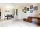 Open-concept living and dining area with tile flooring and vintage-style furniture at 1021 Jaybee Ave, Davenport, FL 33897