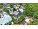 Aerial view of the backyard features a screened-in patio, trampoline, and well-maintained landscaping at 1061 Providence Ln, Oviedo, FL 32765