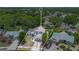 Spacious property with a well-manicured lawn, surrounded by lush greenery, and neighboring homes at 1061 Providence Ln, Oviedo, FL 32765