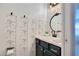 Charming half bath featuring patterned wallpaper, custom vanity and vessel sink at 1061 Providence Ln, Oviedo, FL 32765