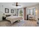 Comfortable bedroom with large bed, desk near window, and modern decor at 1061 Providence Ln, Oviedo, FL 32765