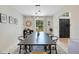 Modern dining room featuring neutral walls, pendant lighting, and view to back yard at 1061 Providence Ln, Oviedo, FL 32765