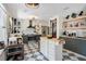 Beautiful kitchen featuring stainless steel appliances, an island, and open shelving for storage at 1061 Providence Ln, Oviedo, FL 32765