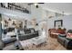 Open-concept living room with high ceilings, comfortable seating, and an abundance of natural light at 1061 Providence Ln, Oviedo, FL 32765
