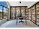 Home office featuring large window, built-in bookcases, desk, and modern decor at 1061 Providence Ln, Oviedo, FL 32765