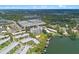 Stunning aerial view of lakeside condo buildings and community with mature trees and water views at 1100 S Orlando Ave # 206, Maitland, FL 32751