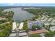 Aerial view overlooking community condos with a serene lake view, surrounded by lush greenery at 1100 S Orlando Ave # 206, Maitland, FL 32751