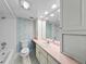 Bathroom with pink vanity, tiled floors, and combined shower and bathtub at 1100 S Orlando Ave # 206, Maitland, FL 32751