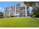 Apartment building features balconies with views of the grounds and water at 1100 S Orlando Ave # 206, Maitland, FL 32751