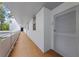 Hallway with door number 206 on a white wall. A long corridor with a metal railing at 1100 S Orlando Ave # 206, Maitland, FL 32751