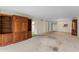 Spacious living room area featuring carpeted floors and access to other rooms at 1100 S Orlando Ave # 206, Maitland, FL 32751
