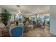 Inviting communal area featuring tile flooring, ample seating, and a bright, airy atmosphere at 1100 S Orlando Ave # 206, Maitland, FL 32751