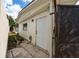 Exterior view of the backyard featuring a door and partial gate at 1105 Arrowsmith Ave, Orlando, FL 32809