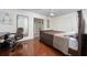 Comfortable bedroom with hardwood floors, work space, and great natural light at 1105 Arrowsmith Ave, Orlando, FL 32809