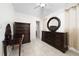 Bedroom with traditional decor, tile floors, a ceiling fan, and dark wood furniture at 1105 Arrowsmith Ave, Orlando, FL 32809