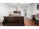 Well-lit bedroom with a large bed, hardwood floors, and neutral colors at 1105 Arrowsmith Ave, Orlando, FL 32809